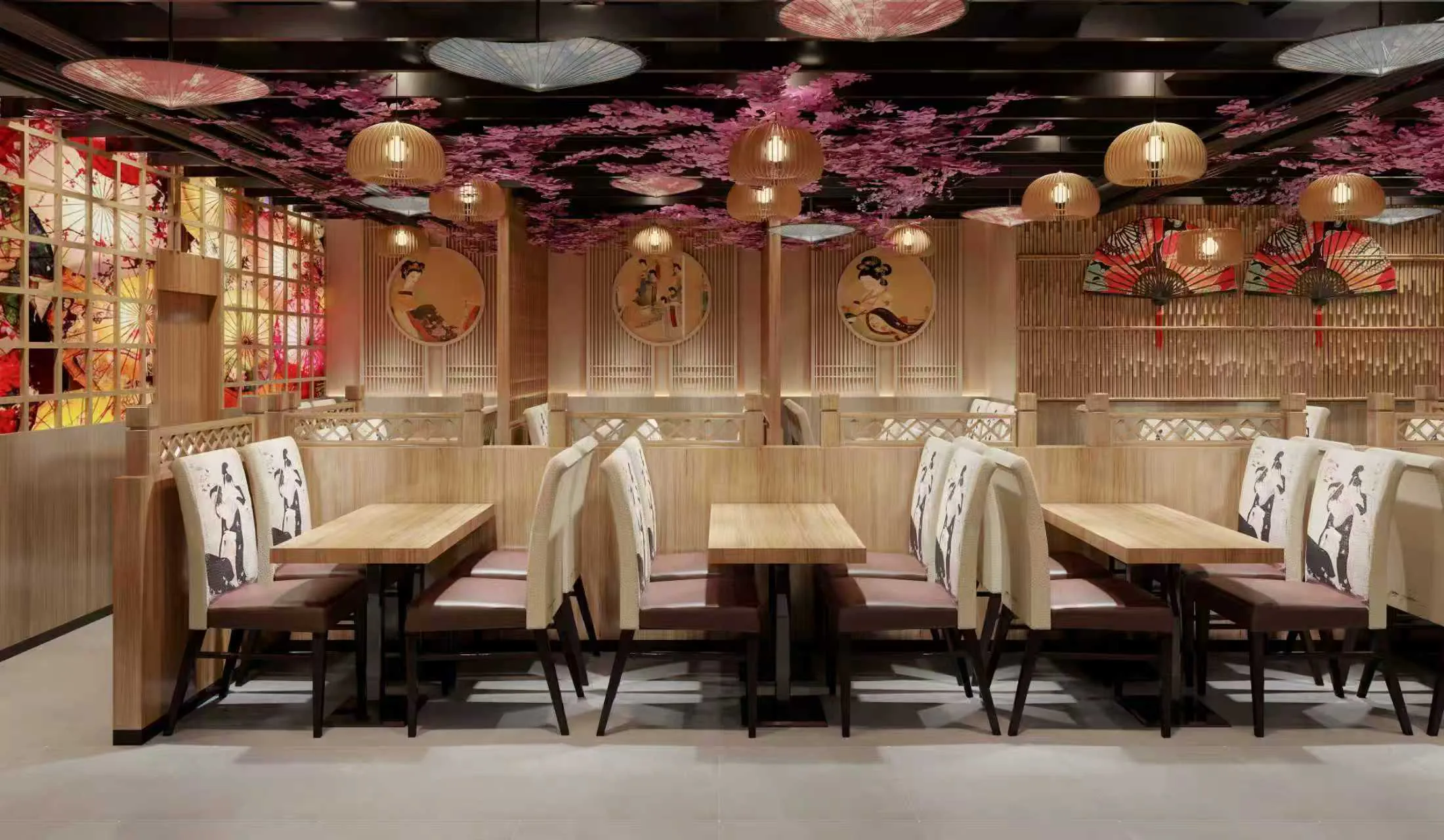 Intimate booth seating with cherry blossom decor at Moto Ramen & Izakaya, a Japanese Restaurant in Vancouver