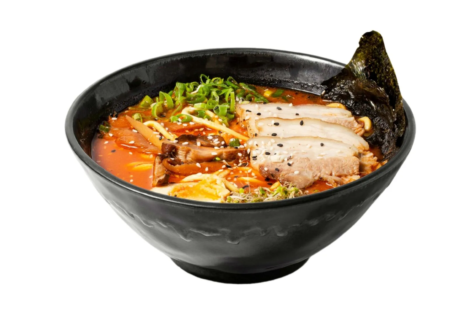 Spicy tonkotsu broth with chashu, mushrooms and nori at Moto Ramen & Izakaya, a Japanese Restaurant in Vancouver